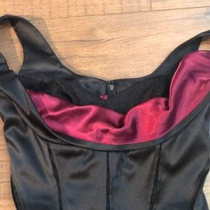 Beautiful WHBM black corset top with maroon trim!